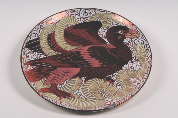 round plat depicting eagle and snake