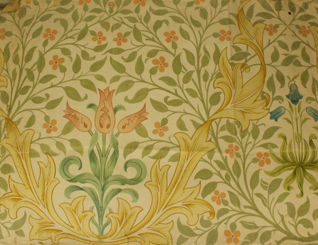 A repeating pattern showing coloured leaves and flowers on a pale background.