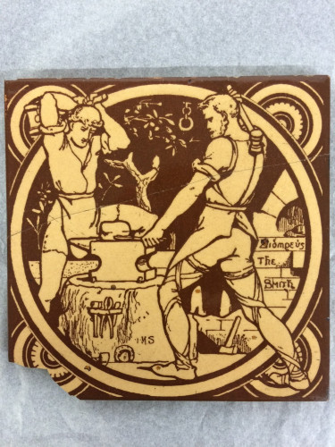 yellow and brown tile showing two men hammering on an anvil