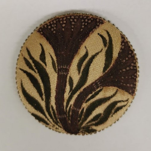 Cream circle with sinuous leaves and plant forms