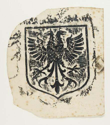 Brass rubbing of a shield design with a two-headed eagle.